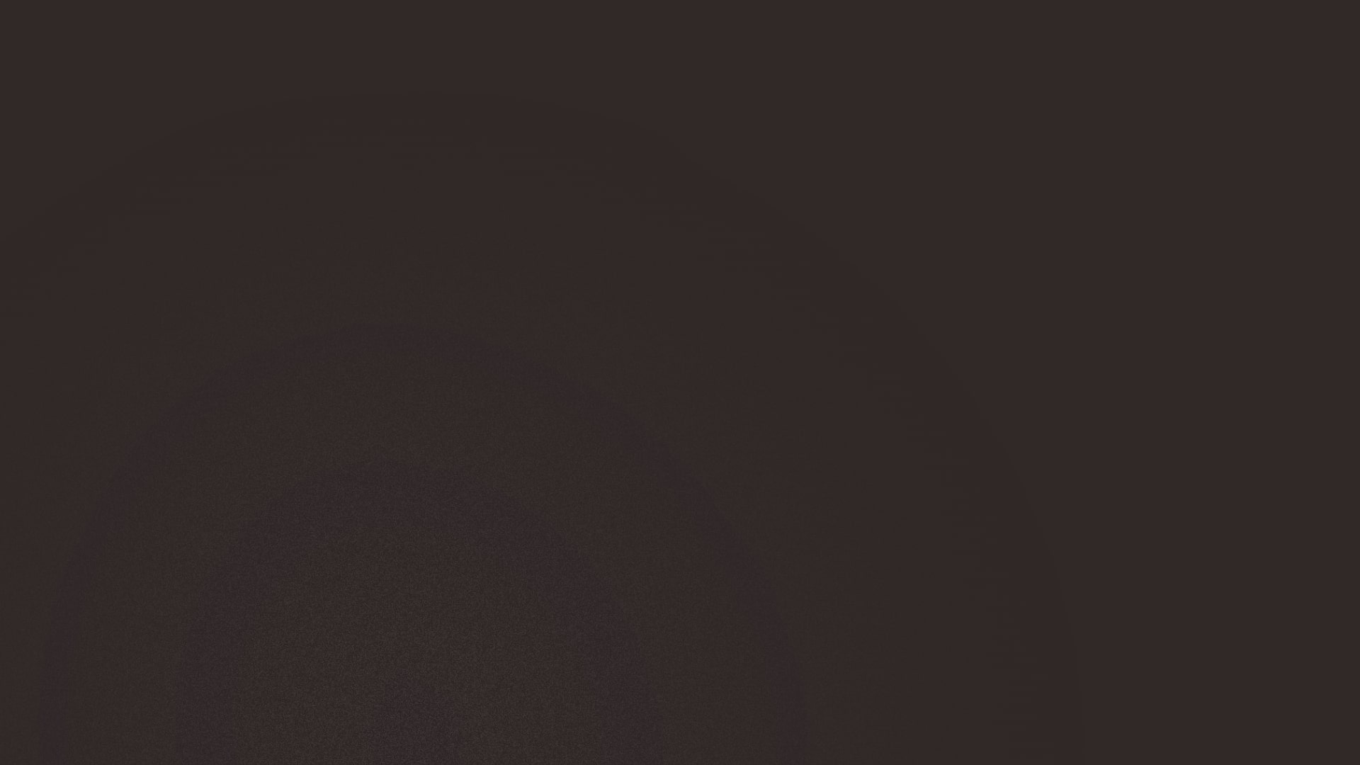 Dunkler Hintergrund mit subtilen kreisförmigen Lichtreflexionen.